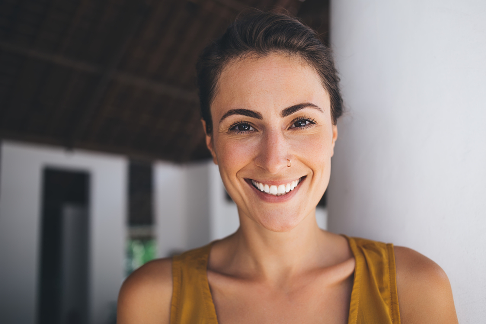 Patient with natural smile after dental visit in Spring TX