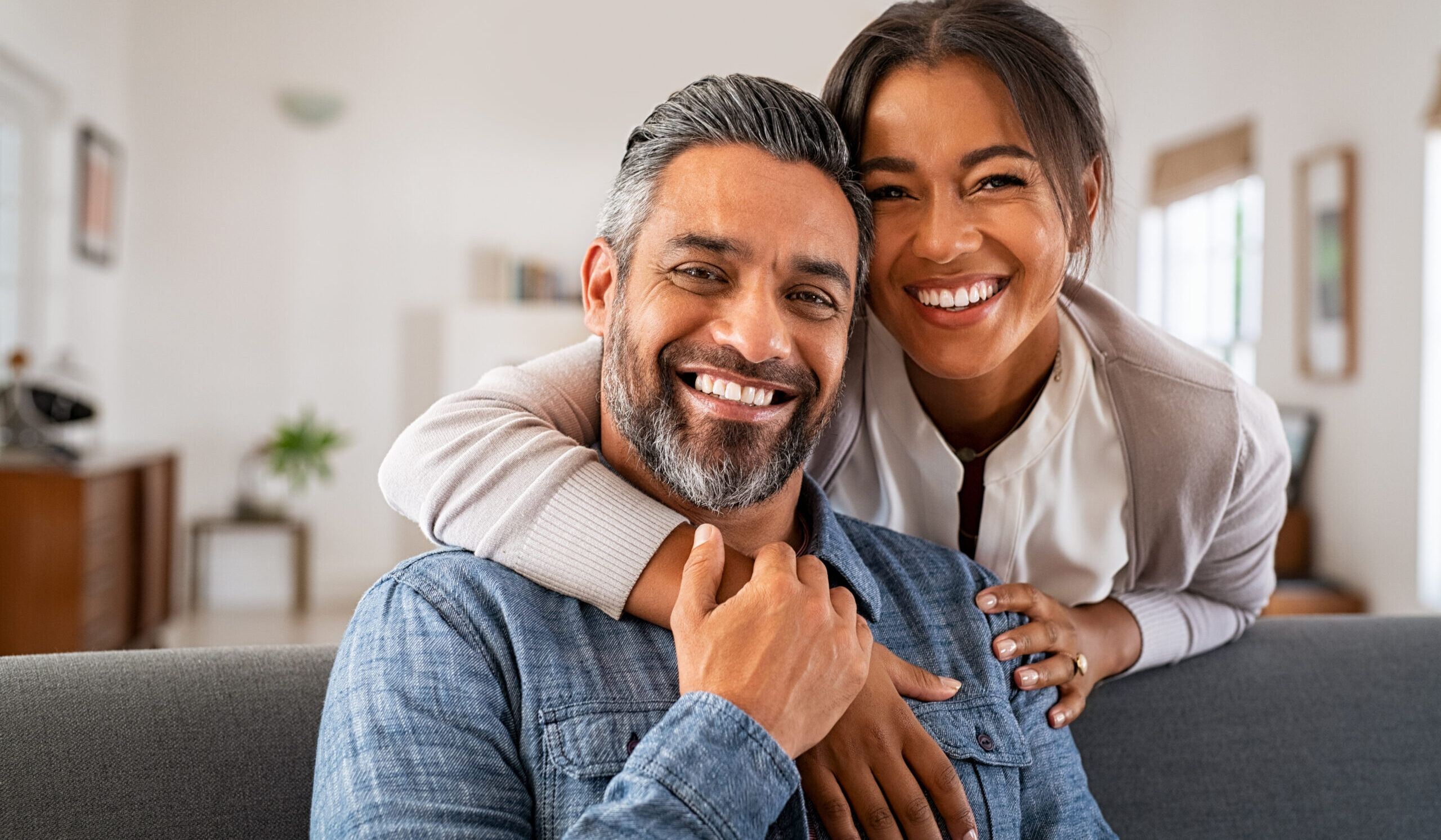 Happy couple with healthy smiles after dental treatment in Spring TX