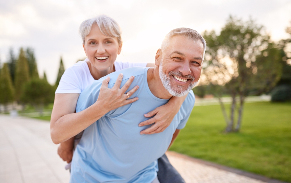 couple smiling after restorative dental care in Spring TX