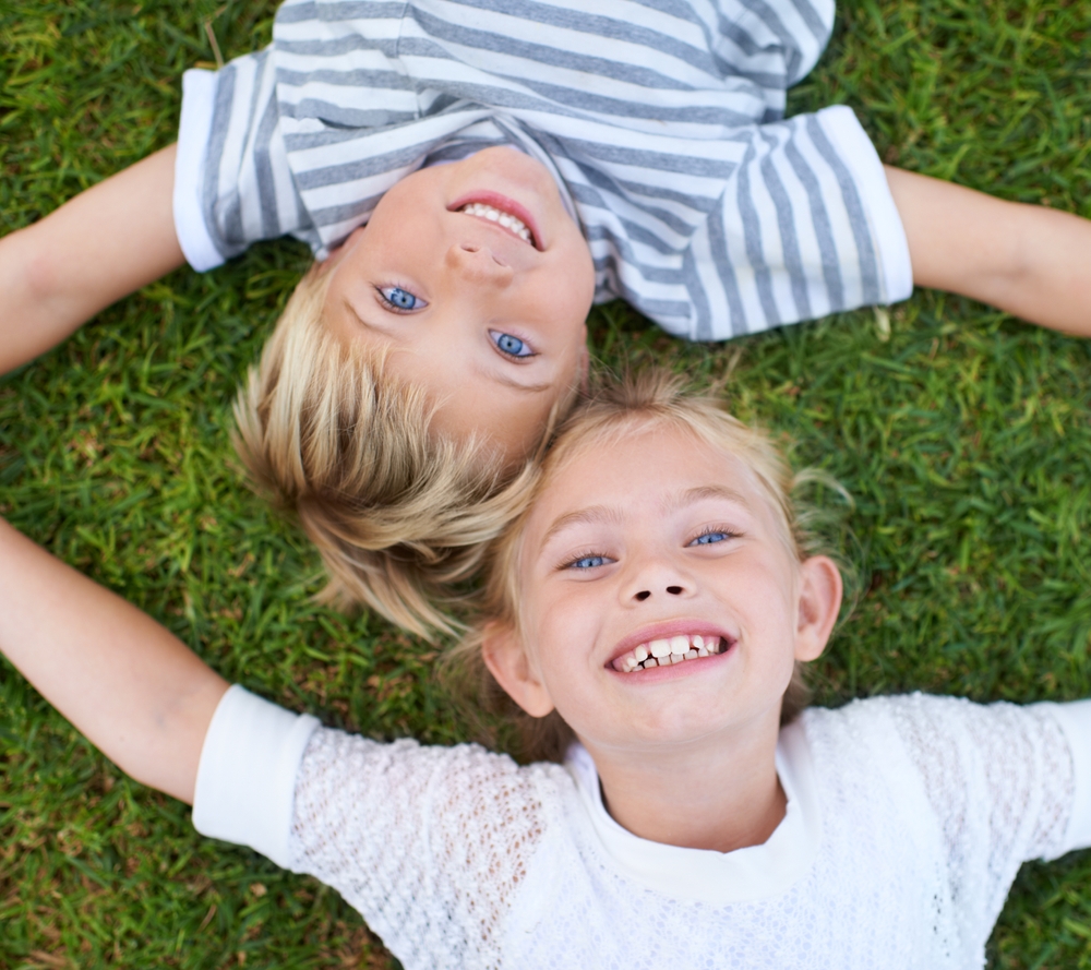 Children smiling after pediatric dental visit in Spring TX