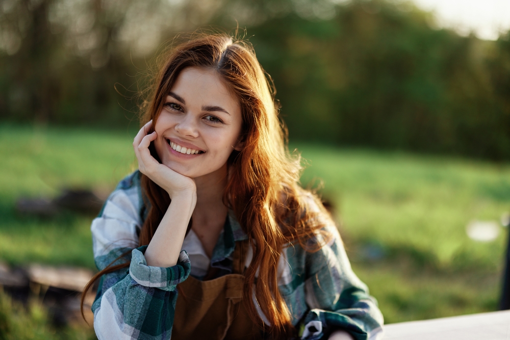 Young woman with bright smile after dental treatment in Spring TX