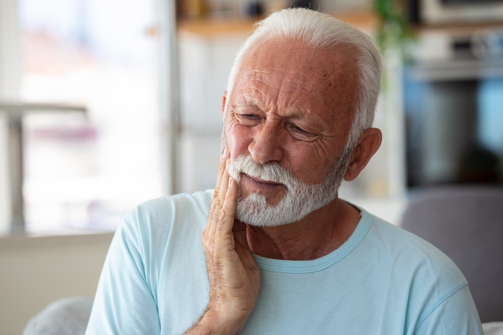 man with toothache needing emergency dental care in Spring TX